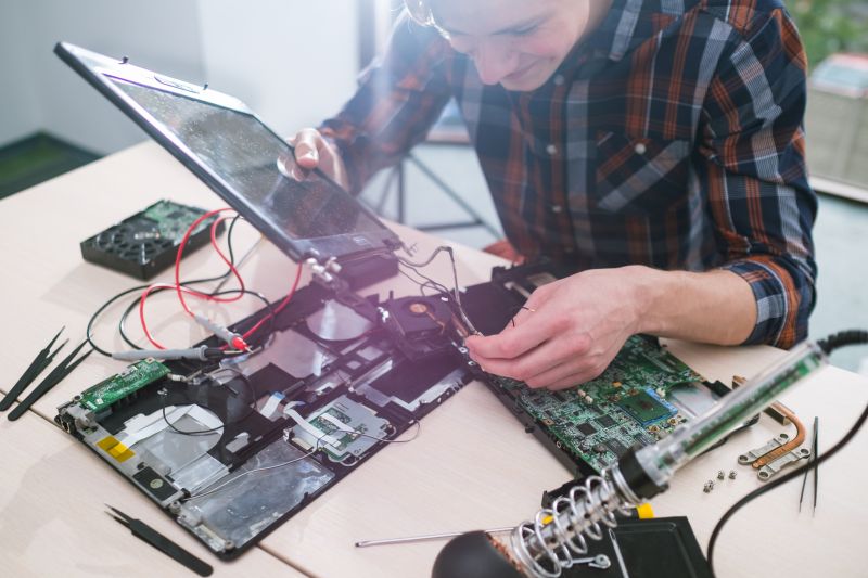 Technician Inspecting Touchpad
